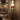 Modern floor lamp in a cozy living room setting with warm lighting.
