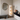 Modern interior with a floor lamp, mirror, and decorative items.