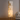 Modern floor lamp with square, tiered lampshades in a living room setting.