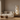 Modern living room with a beige sofa, wooden coffee table, and decorative lamp.