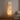 Stacked square lamp in a living room setting with a sofa and neutral decor.